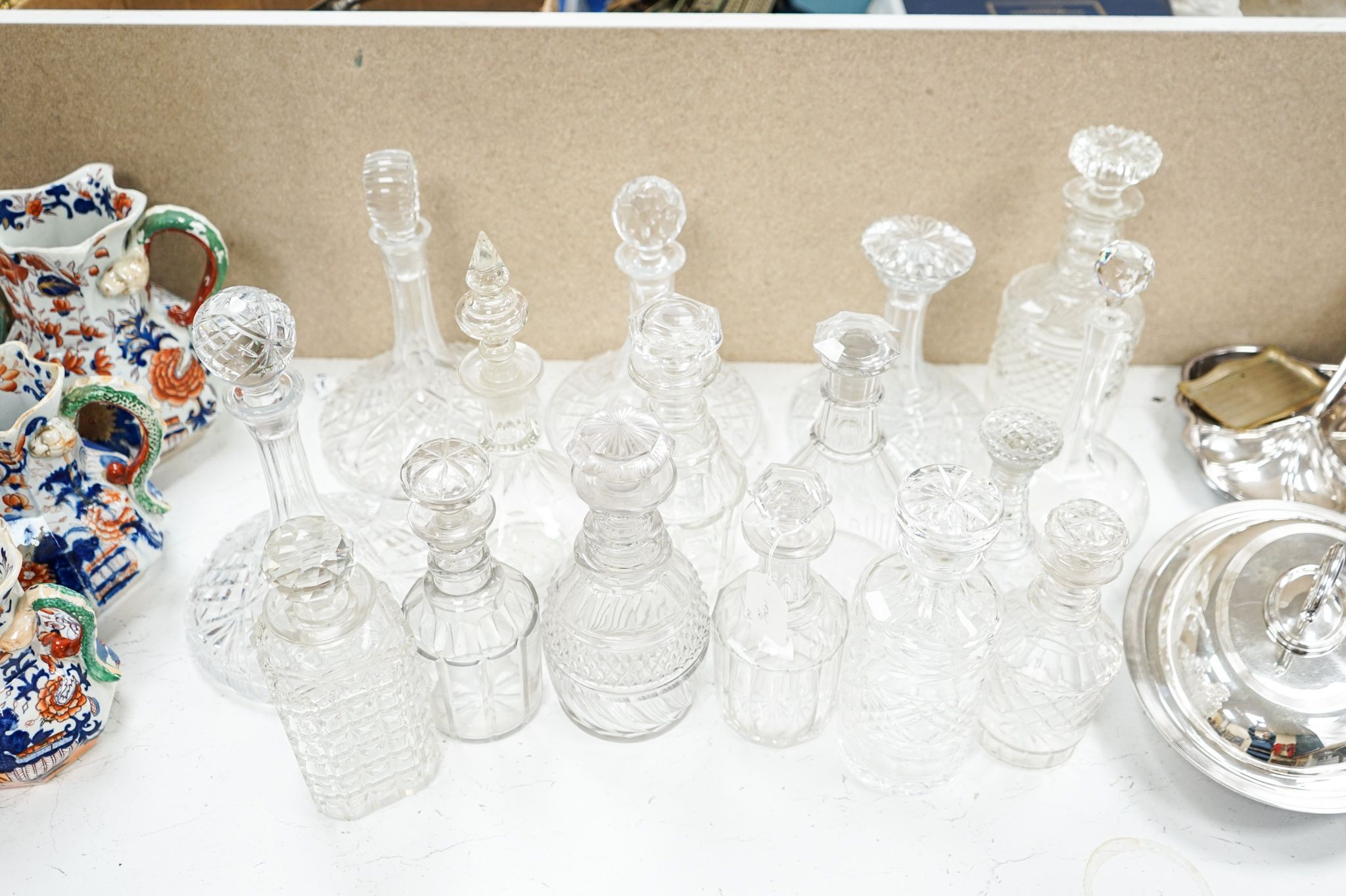Fourteen various glass decanters 33cm